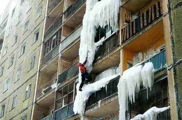 man climbing ice